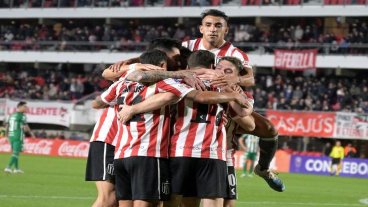 Estudiantes players celebrate a goal